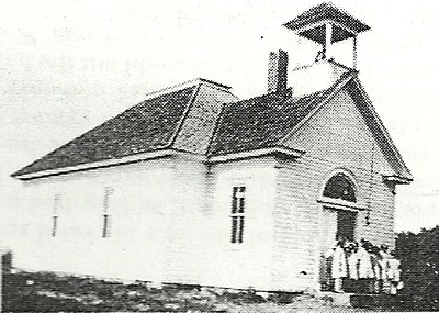 Black and white photo of a schoolhouse