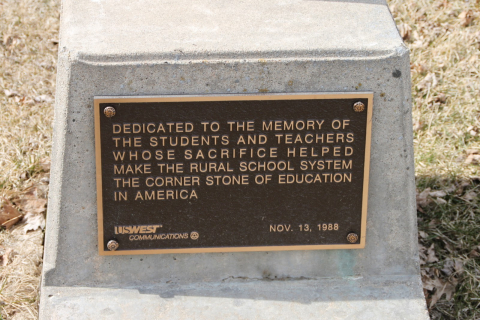 Dedication plaque outside the schoolhouse