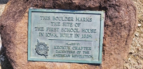 Plaque on the boulder marker