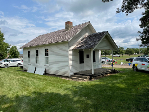 Photo of a white schoolhouse