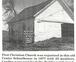 White schoolhouse in use as a shed