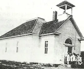 Black and white photo of a schoolhouse