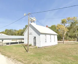White schoolhouse on fairground