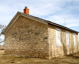 Back of the stone schoolhouse