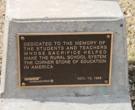 Dedication plaque outside the schoolhouse