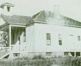 Schoolhouse with a porch and belfry