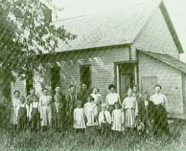 Lincoln No. 4 class photo in front of the schoolhouse