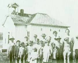 Class photo in front of the school